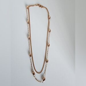 Layered rose gold tone necklace with dainty beaded accents. Lightweight, elegant
